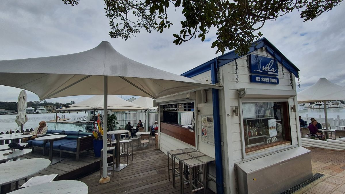 Vela Dining & Bar - Logo