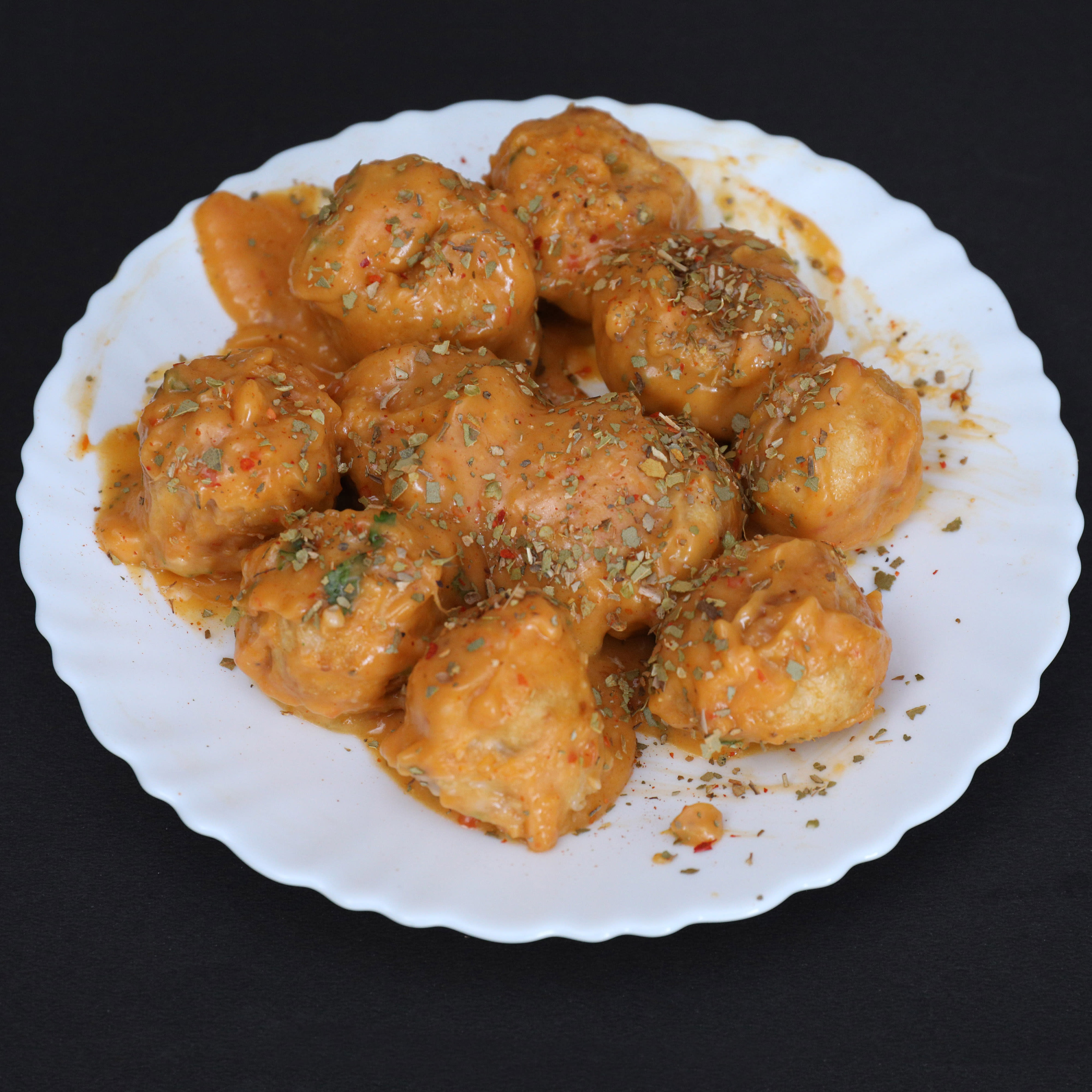 Vicky marinated momos - Logo