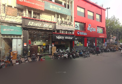 VIJAY SALES MODEL TOWN - Logo
