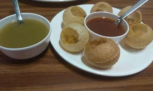 Village 12 - 20 Veg Restaurant & Sweets - Logo