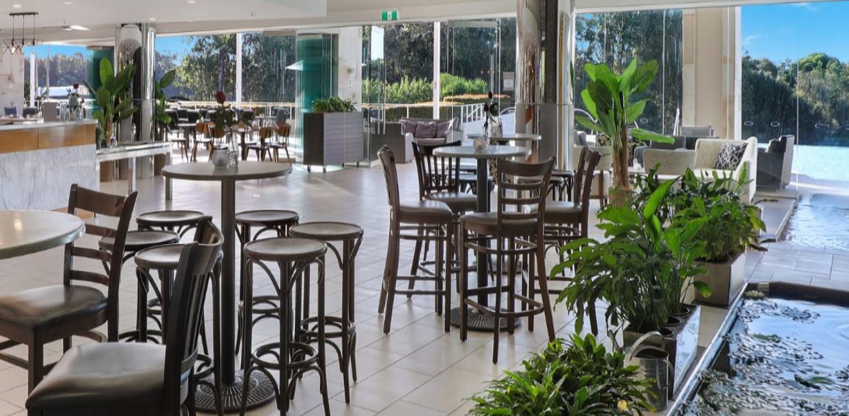 Waterlilies Restaurant at Pelican Waters Resort - Logo