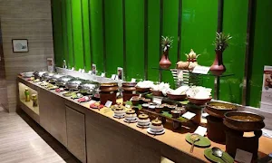 Welcomcafe Jacaranda, Welcomhotel Bengaluru - Logo