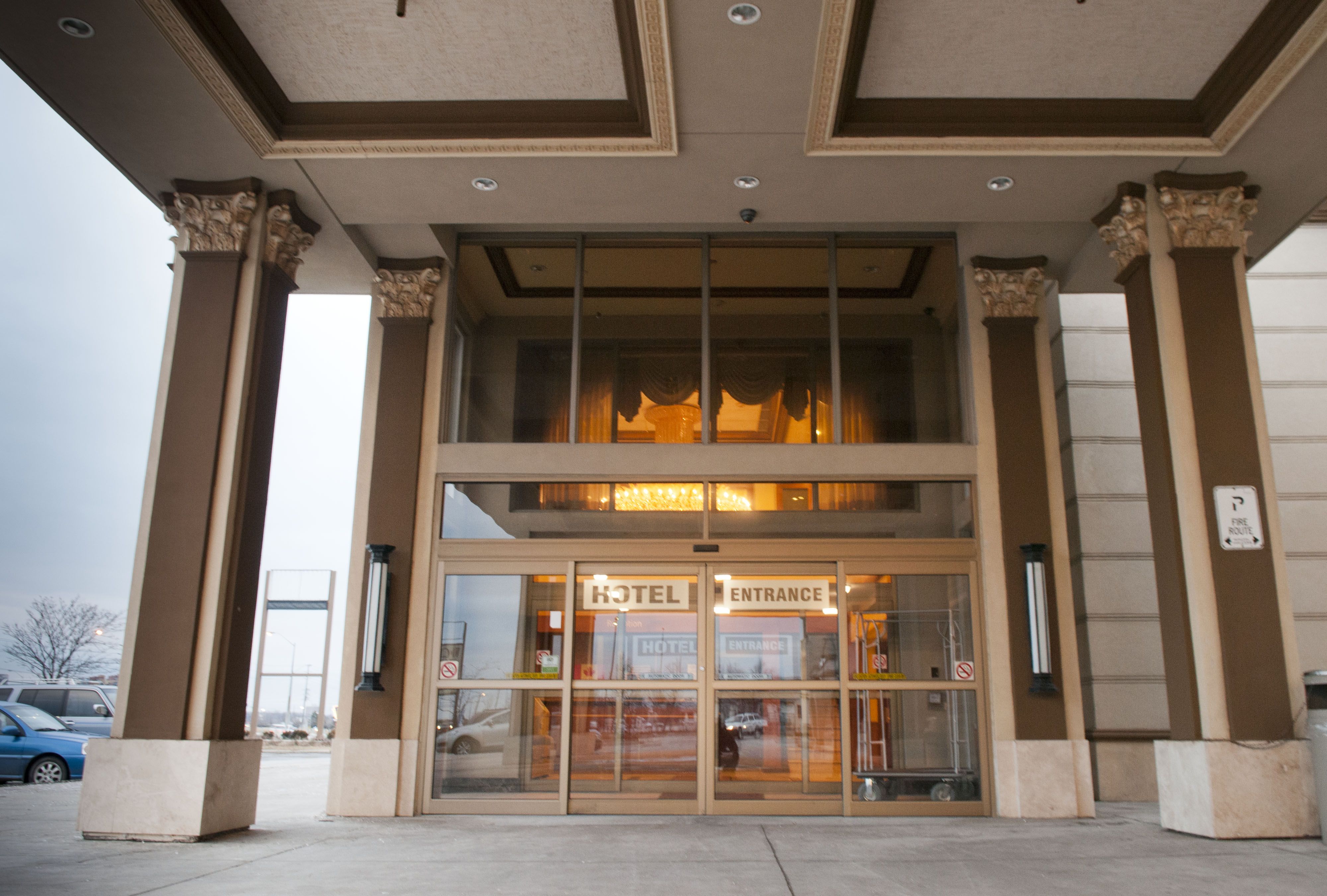 Woodbine Hotel and Suites - Logo