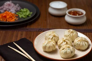 Zomoz - Specialty Momos - Logo