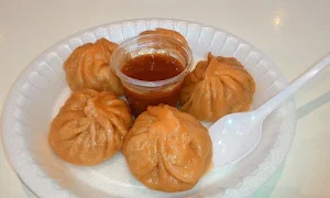 Zomoz - Specialty Momos - Logo